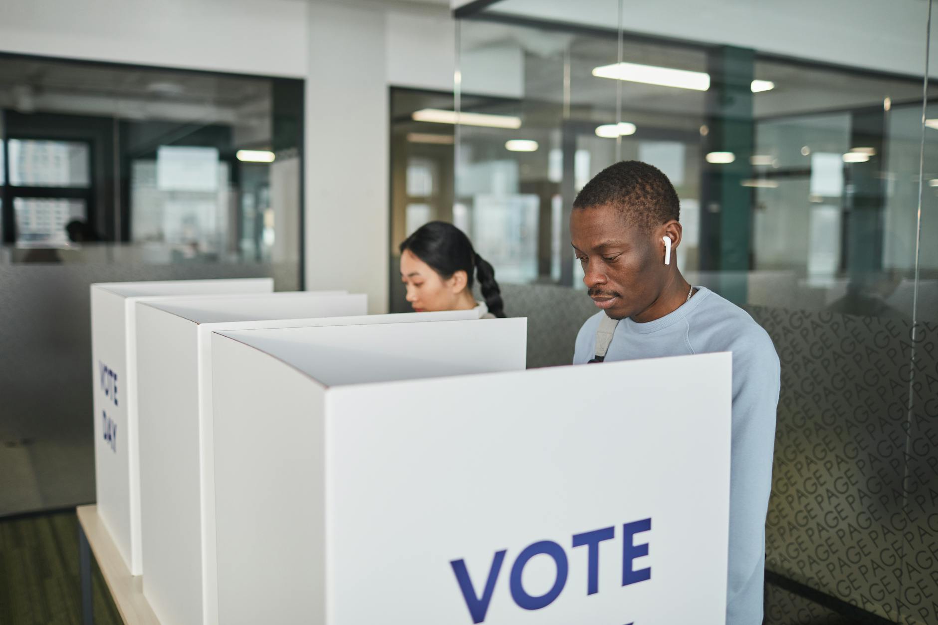 Interior view of voting booth with ballot marking equipment and privacy screens