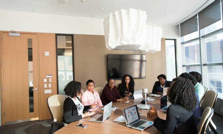 Corporate executives in a boardroom meeting discussing business strategy and financial decisions
