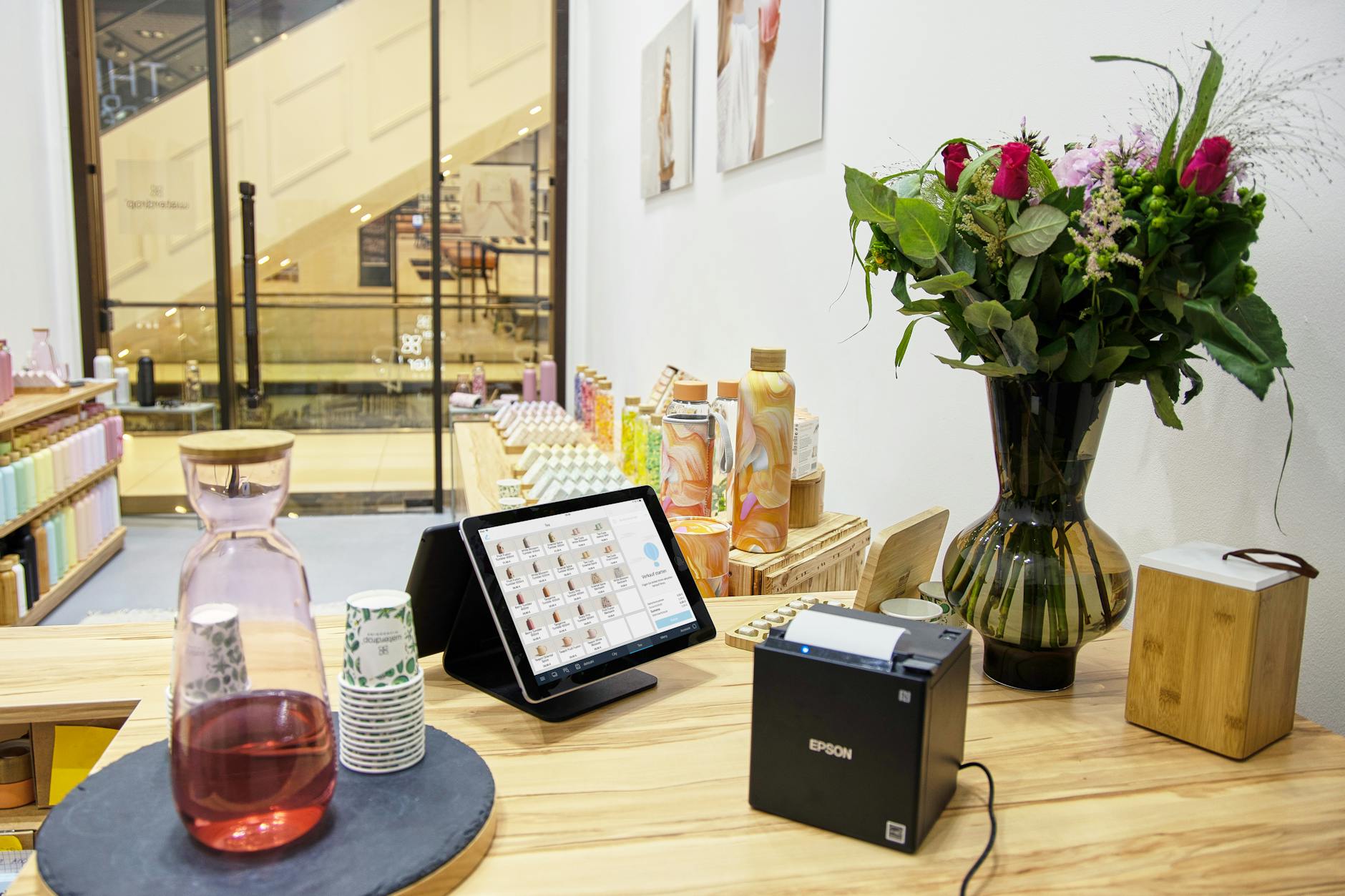 Modern retail checkout counter with traditional cashier station and point-of-sale system