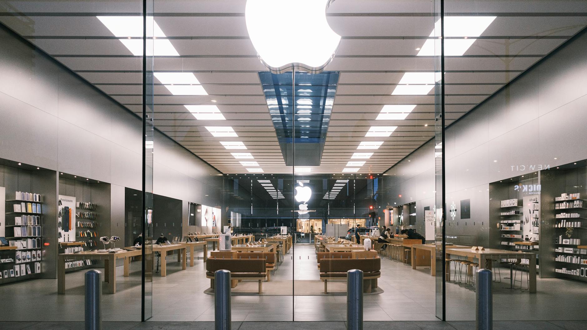 Modern retail store interior with clean white shelving and product displays