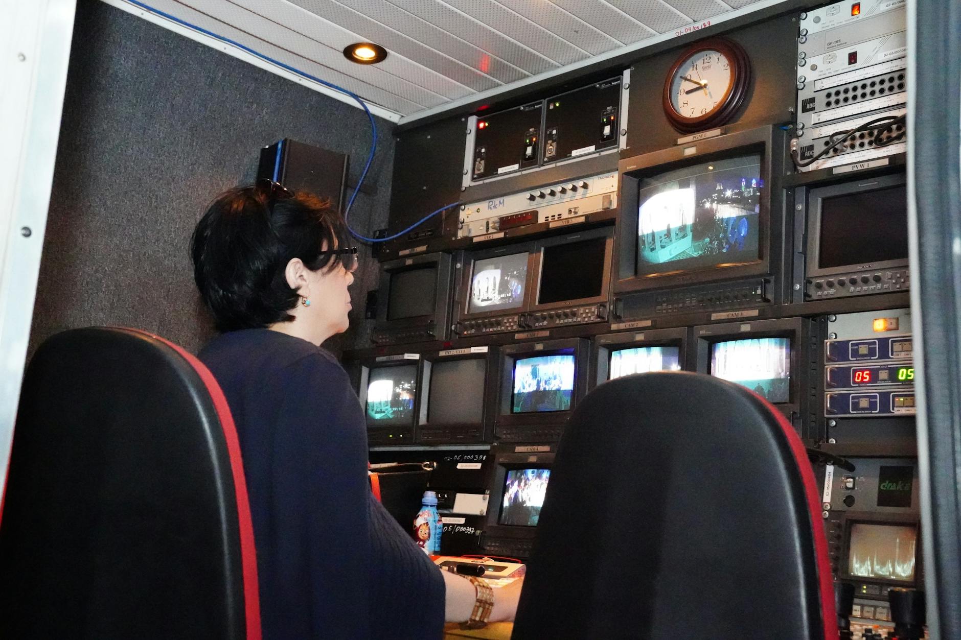 Modern television broadcasting studio with professional lighting and camera equipment