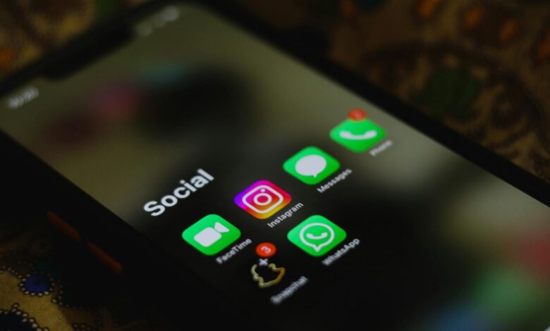 Close-up of smartphone displaying social media interface with political content