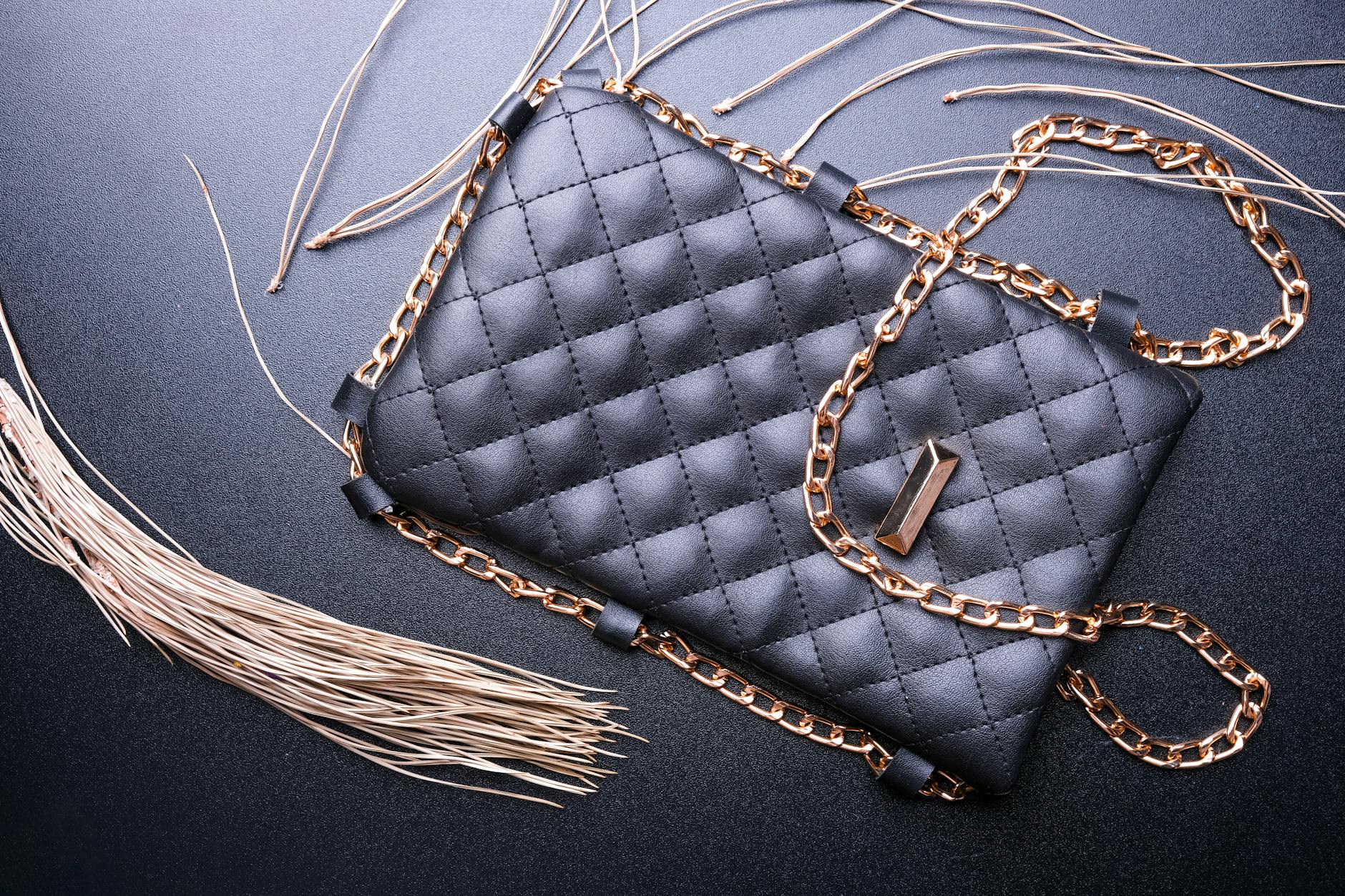 Collection of luxury designer handbags displayed on white background