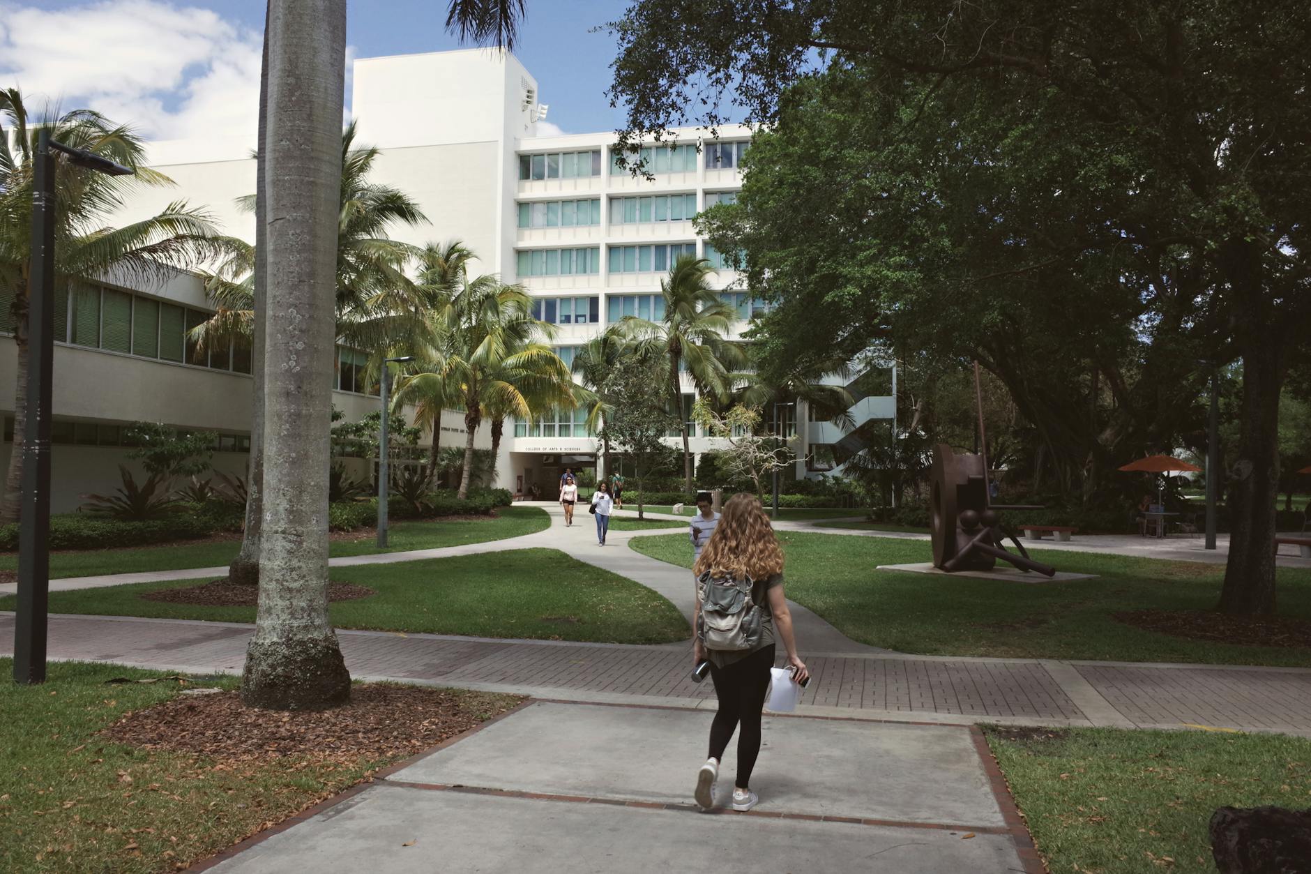 University campus with students walking between academic buildings