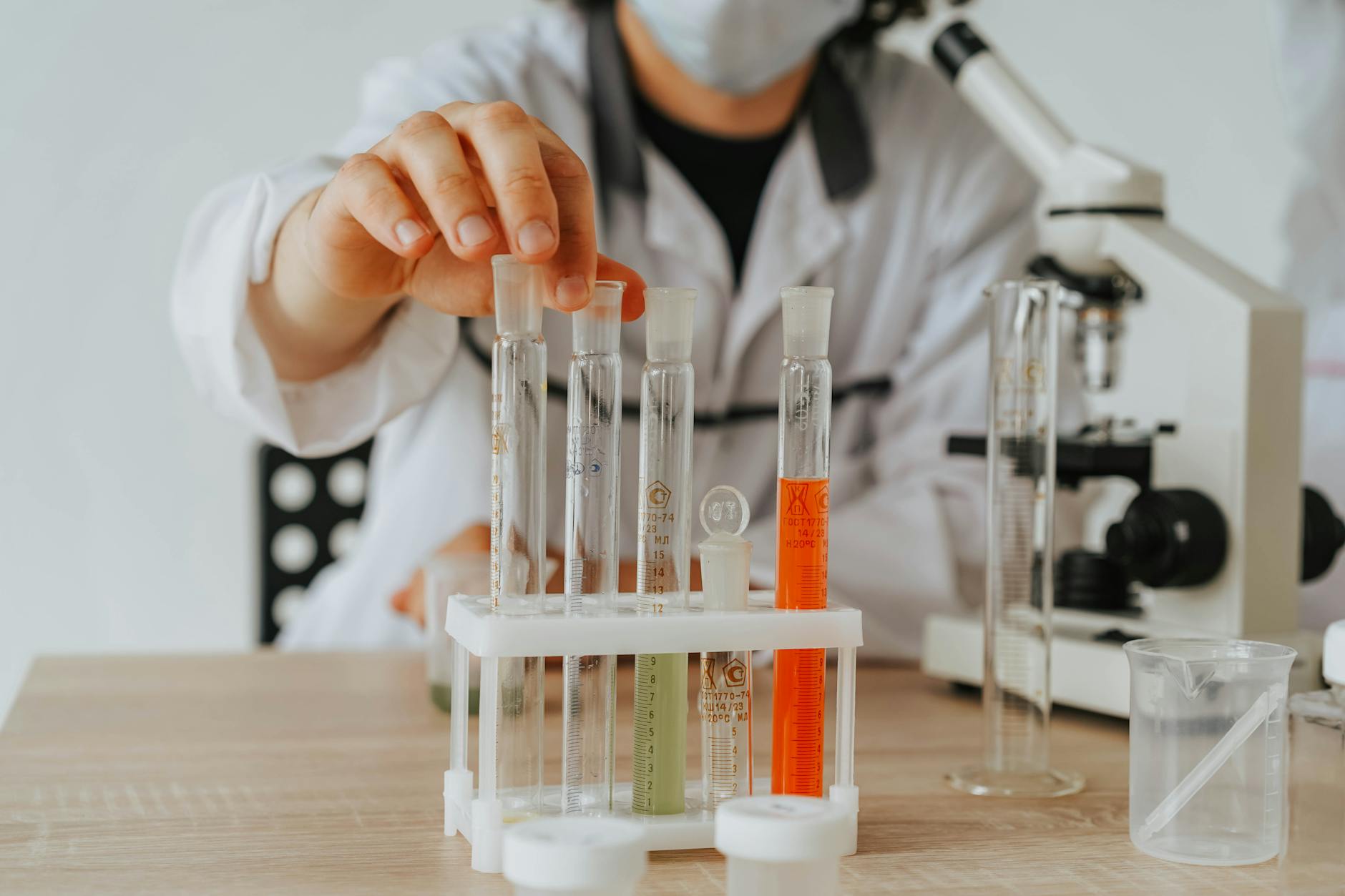 Scientists working in pharmaceutical research laboratory with equipment and test tubes