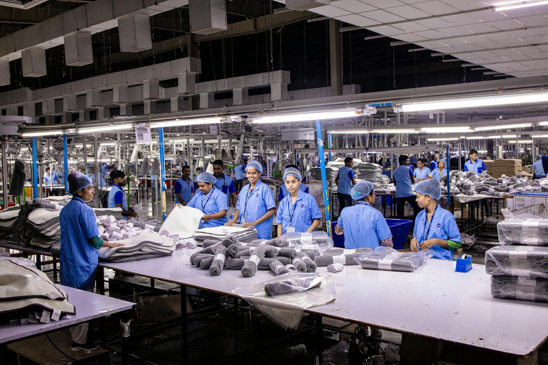 Modern manufacturing facility with automated production equipment and workers