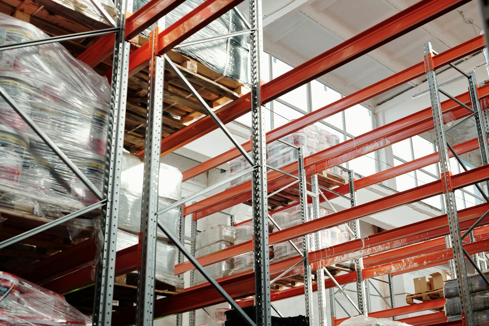 Modern warehouse interior with automated systems and conveyor belts showing retail fulfillment operations