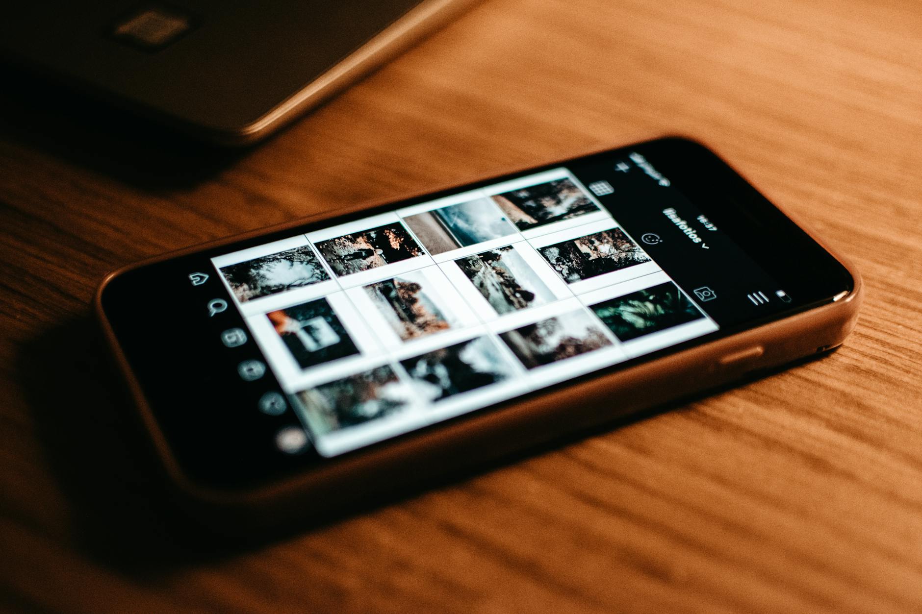Person using smartphone with social media apps visible on screen