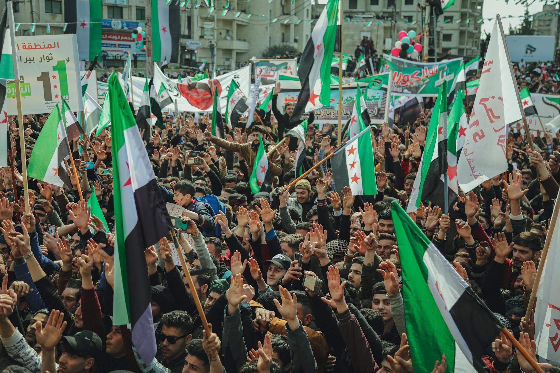 Crowd of people at a political rally or campaign event