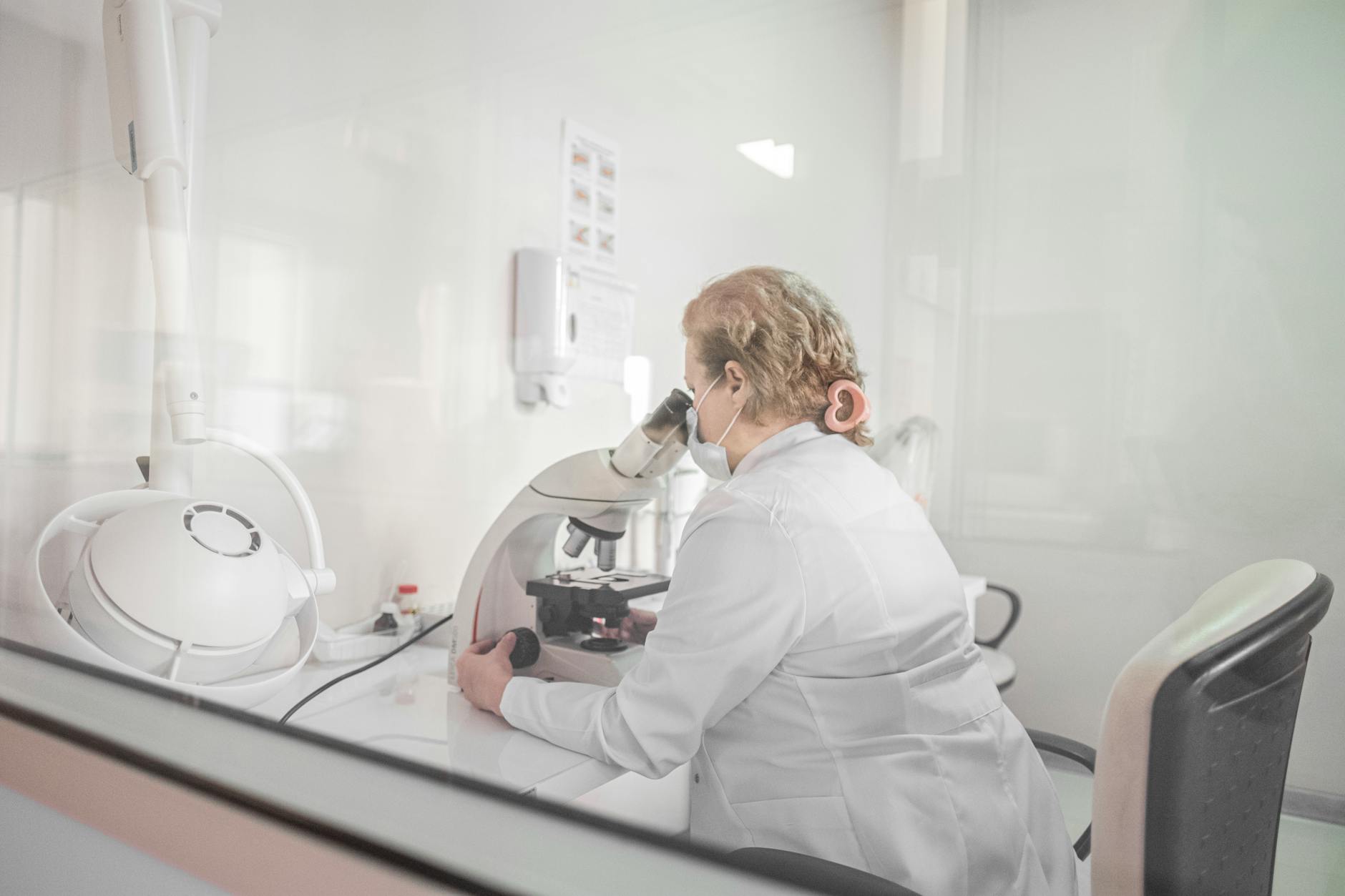 Scientist working in pharmaceutical laboratory conducting drug development research