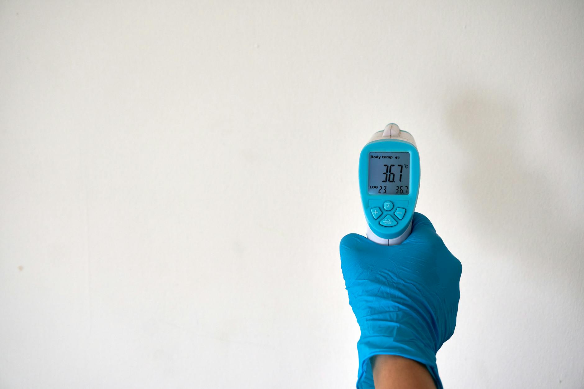Close-up of a thermometer showing high temperature reading