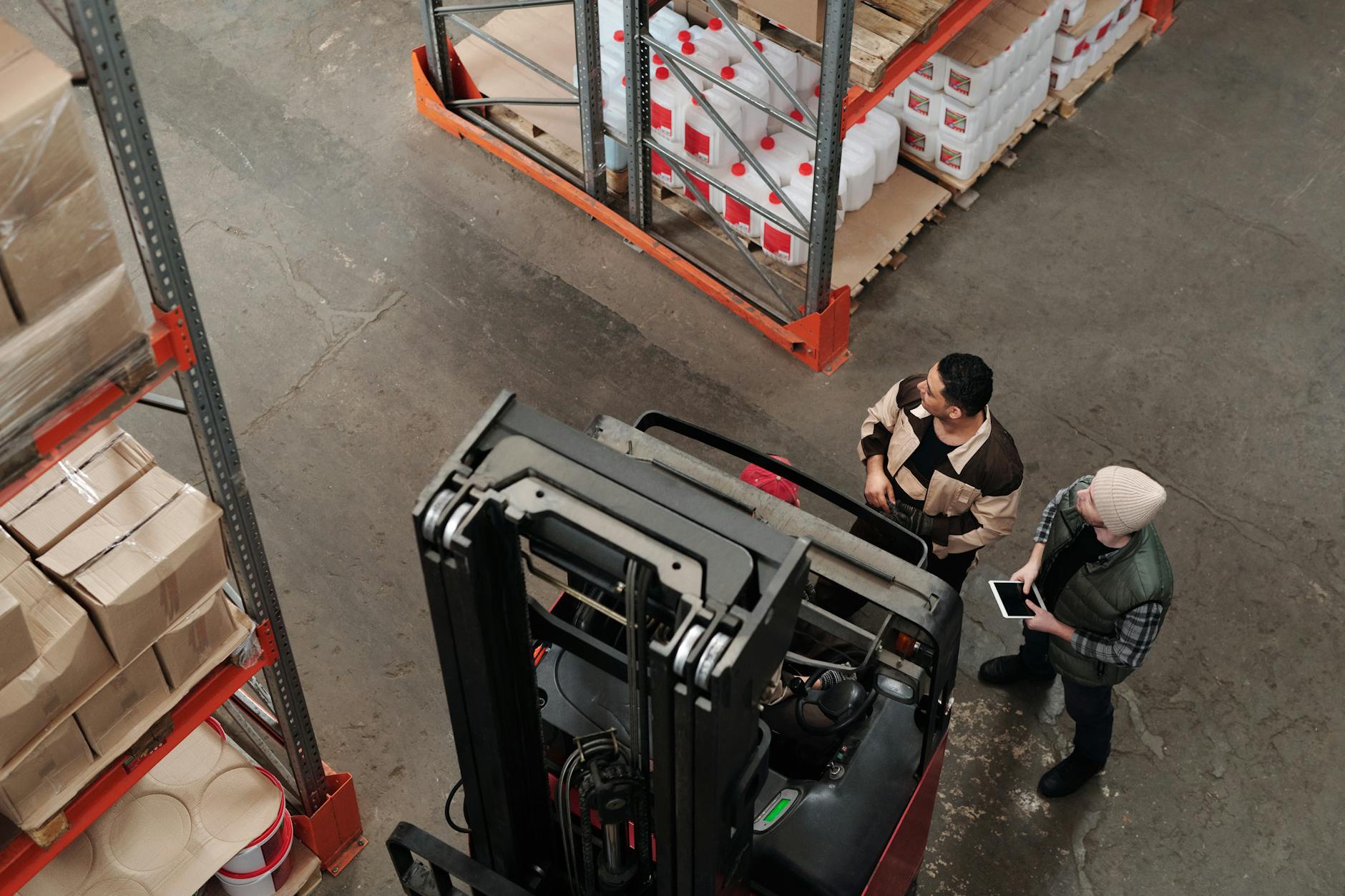 Workers in fulfillment center organizing packages for delivery