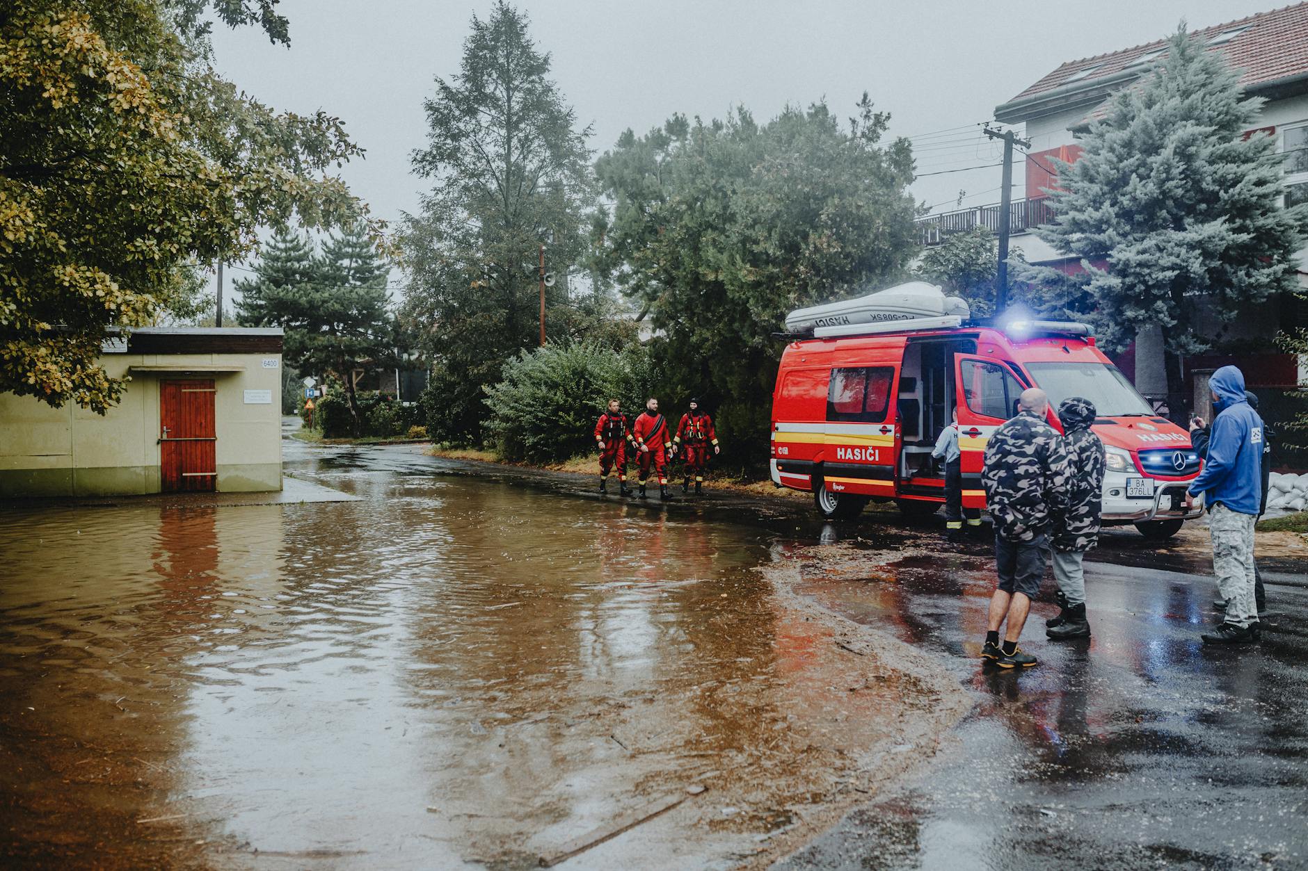 Aerial view of flooded residential neighborhood demonstrating widespread property damage from extreme weather