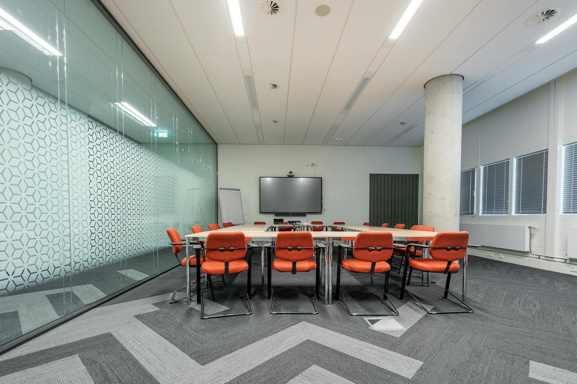 Corporate meeting room with business professionals discussing employee wellness programs