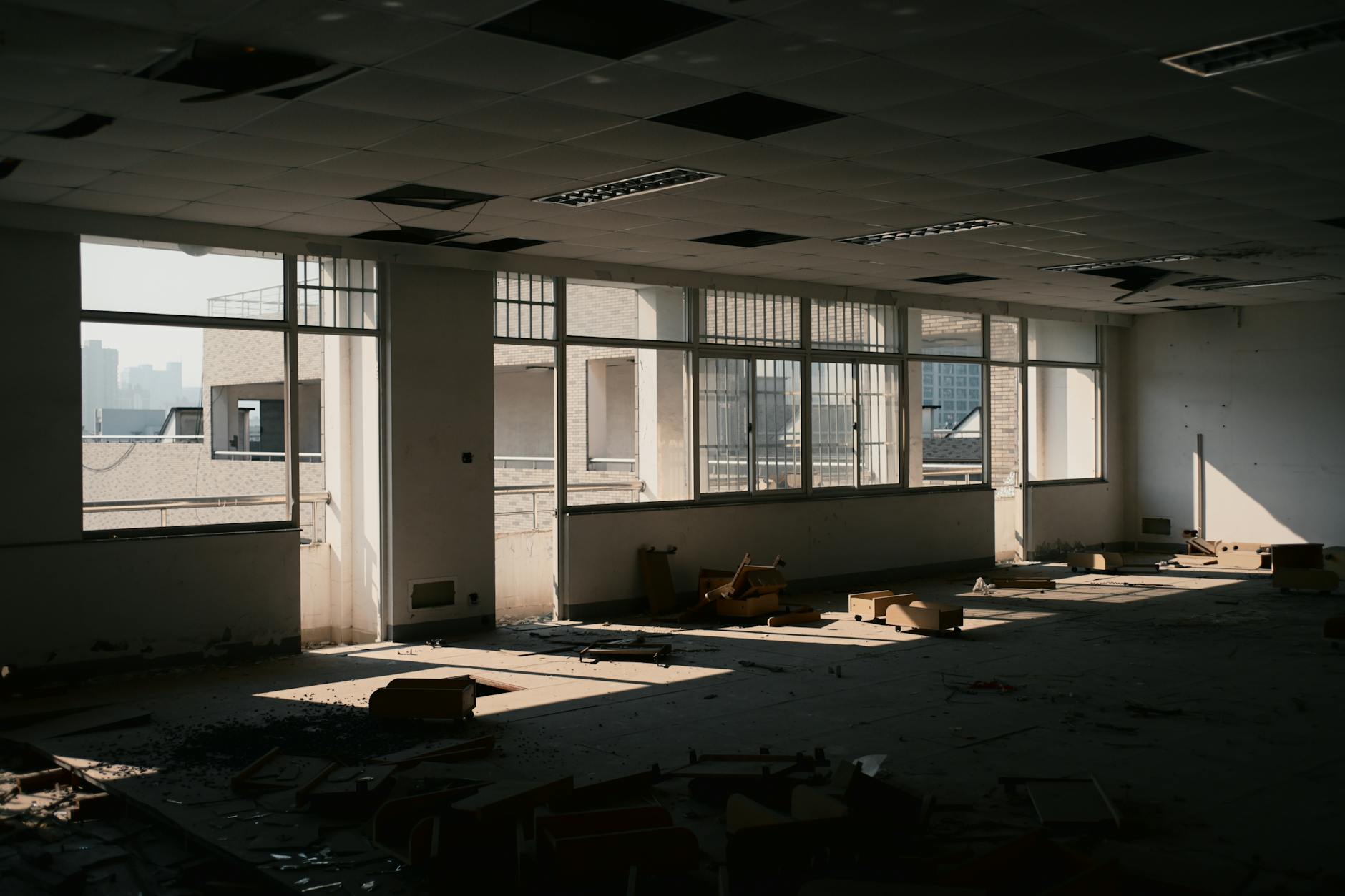 Vacant office space with empty desks and chairs where a newspaper newsroom once operated