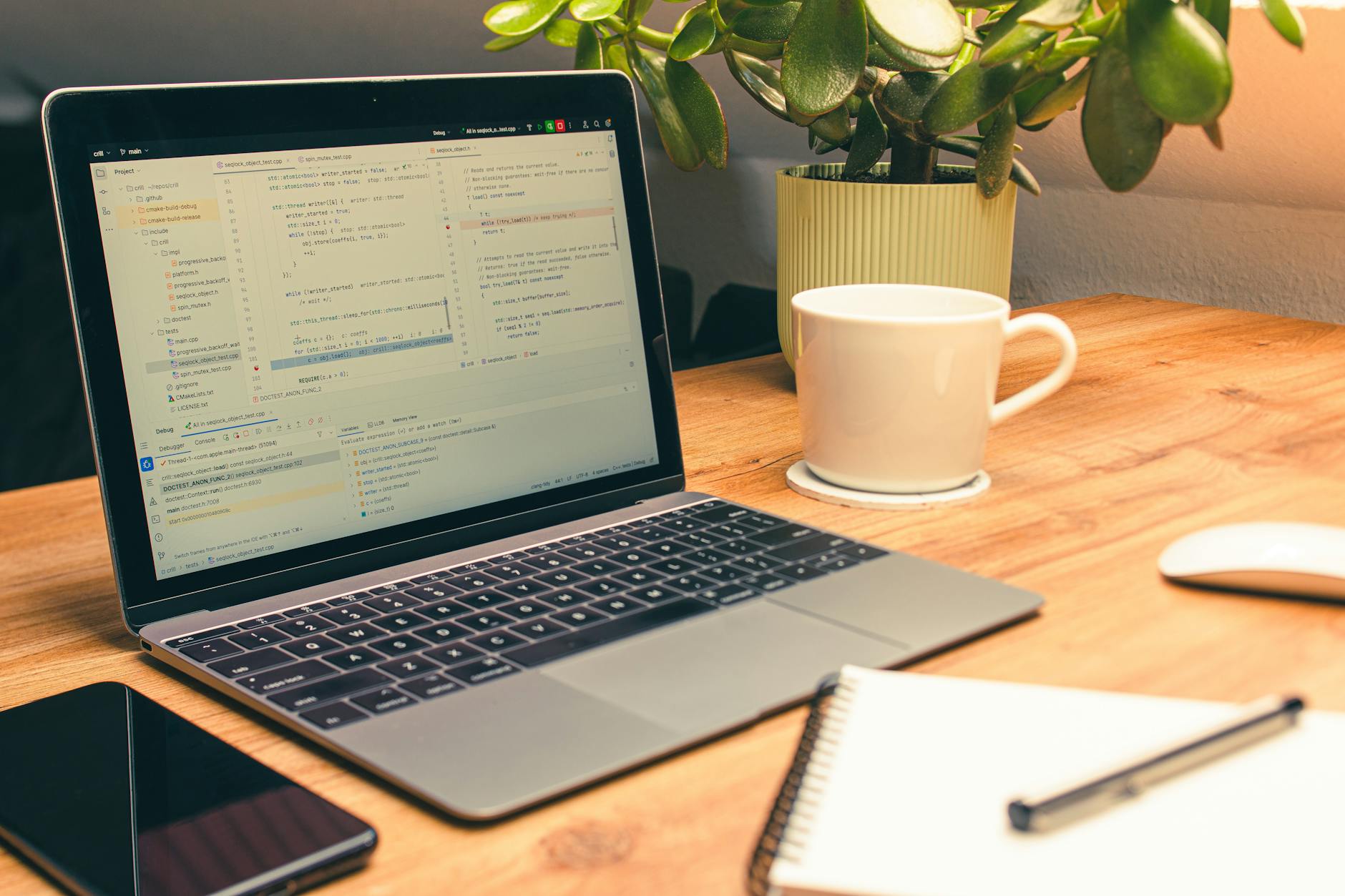 Clean organized workspace with laptop and coffee showing modern work environment