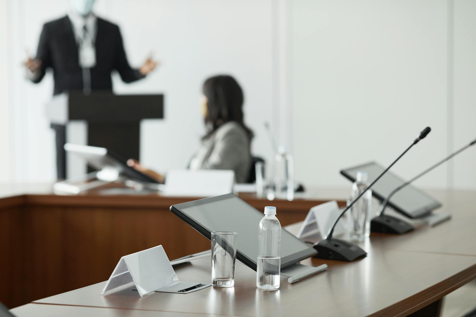 Executive boardroom meeting with business professionals discussing corporate strategy