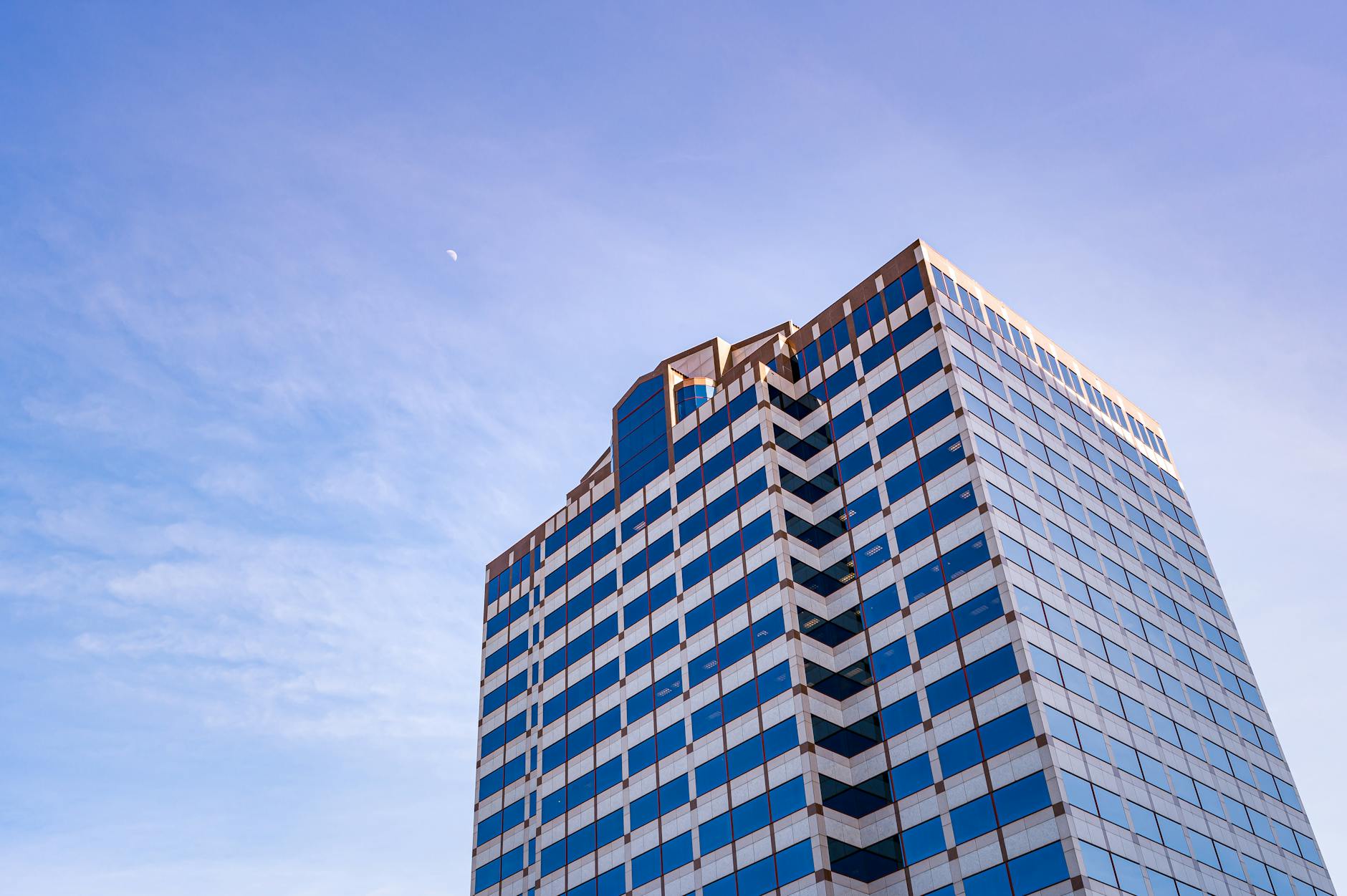 Modern corporate office building exterior with glass facade and professional architecture