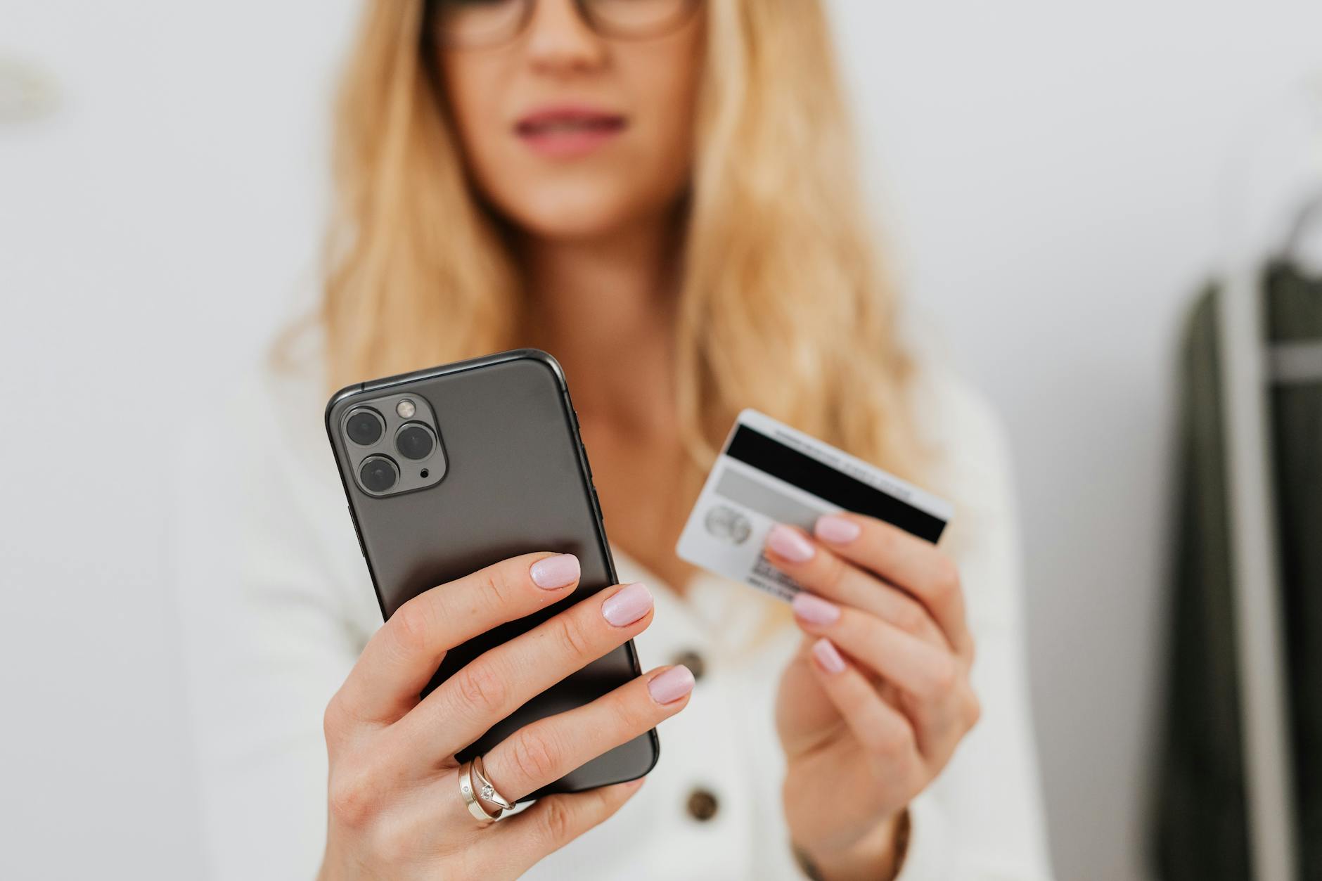 Hand holding smartphone showing grocery delivery app interface