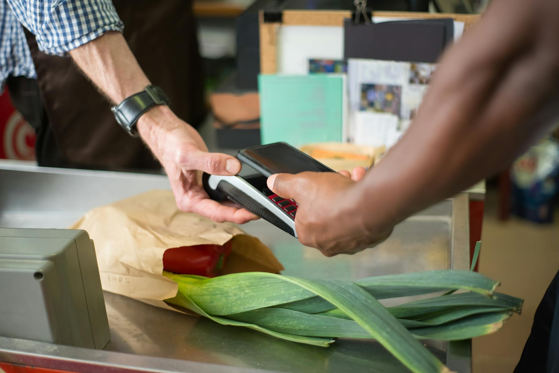 Modern retail checkout counter with payment terminal and scanner