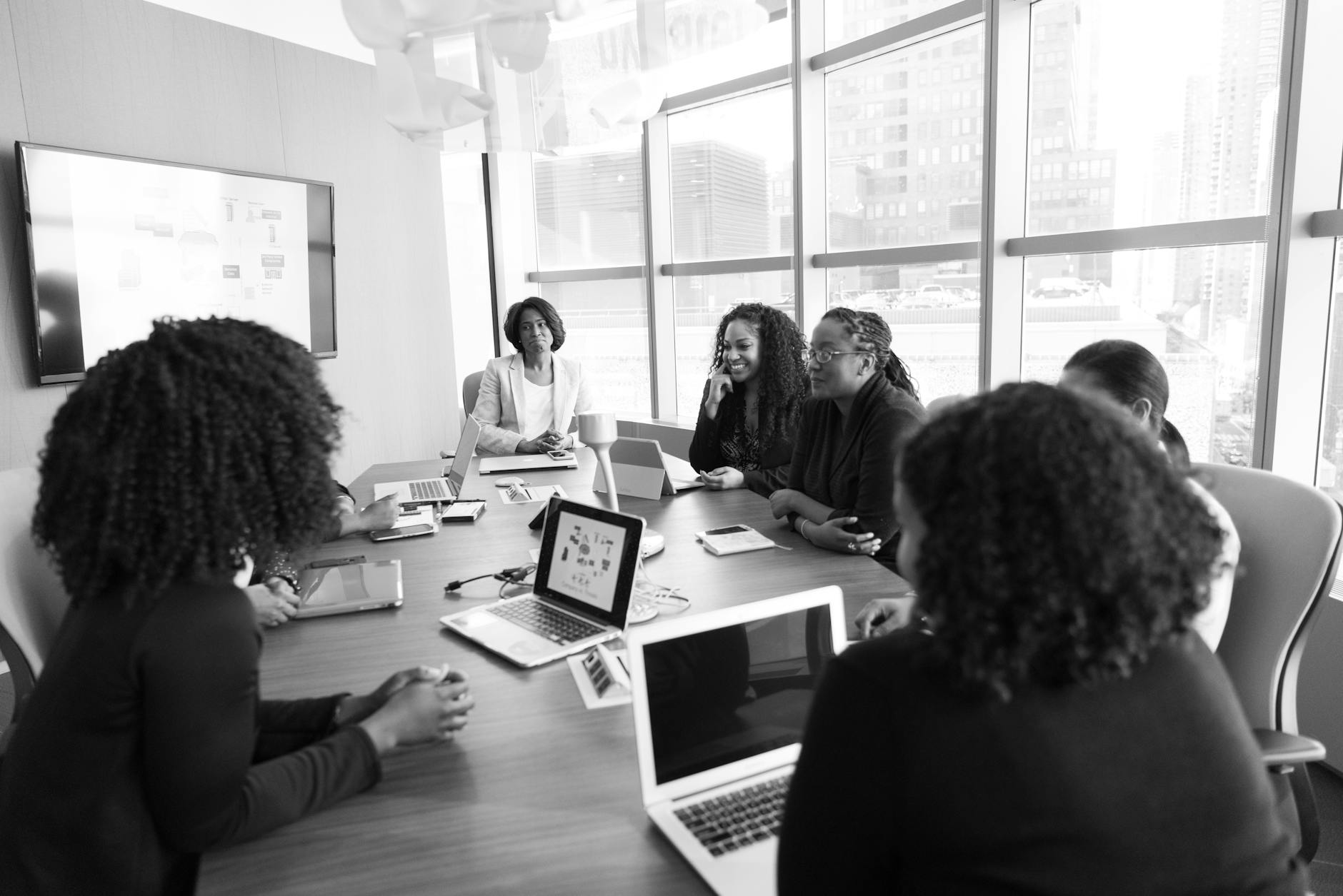Business professionals discussing technology compliance and regulatory frameworks