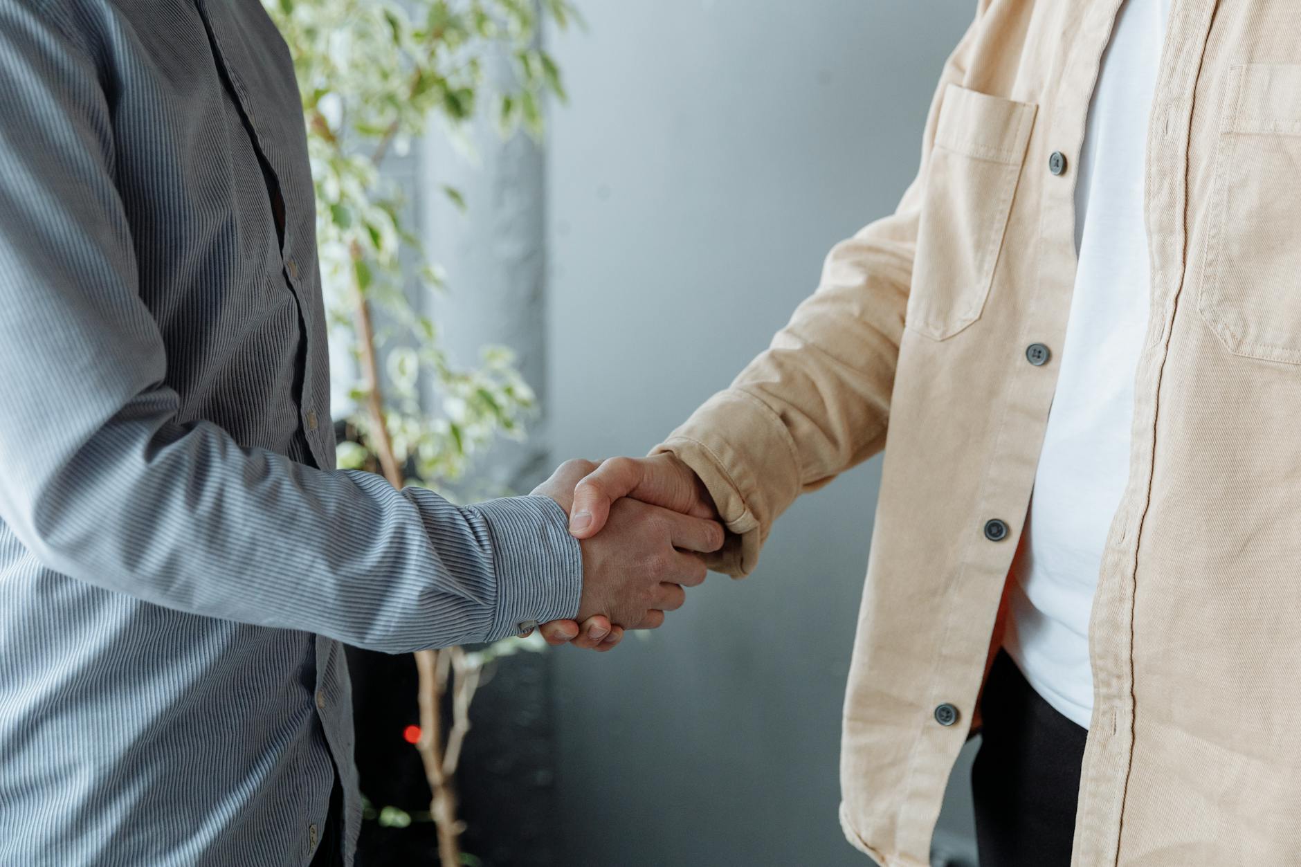 Professional handshake representing successful business partnership and workplace agreement