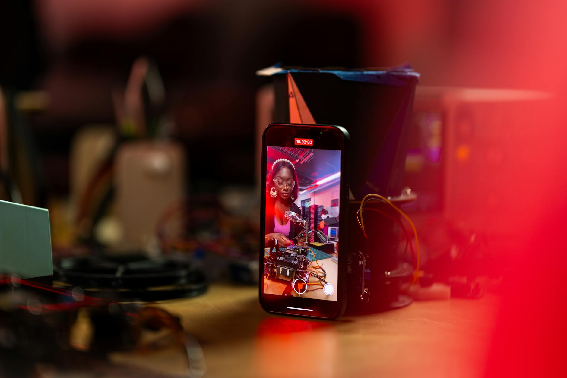 Person watching live sports content on smartphone screen while sitting comfortably