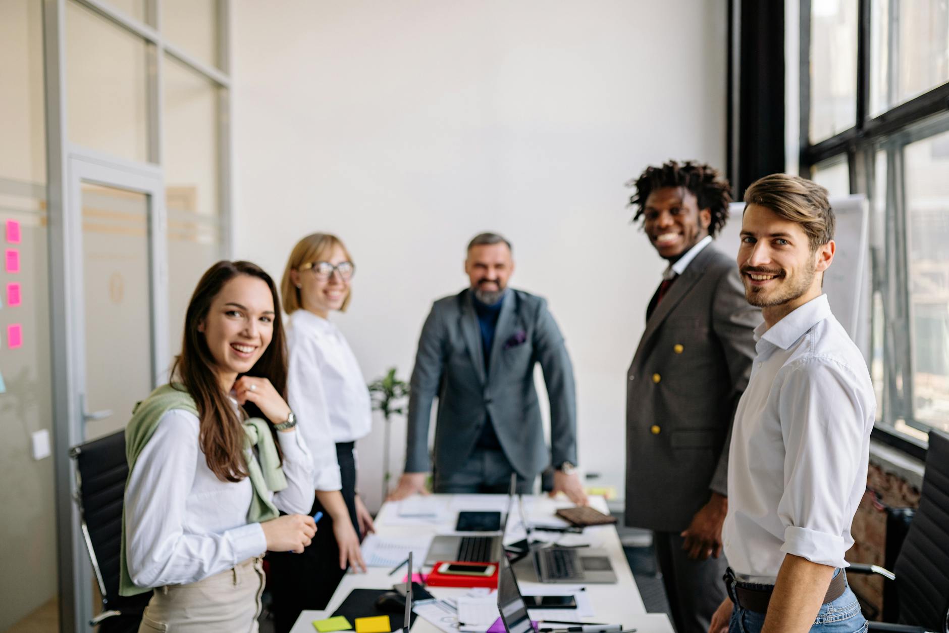 Diverse office team collaborating in modern workplace environment