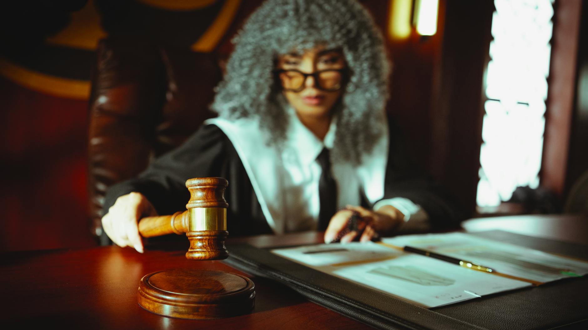 Judge's gavel and law books representing ongoing constitutional implications and legal precedent