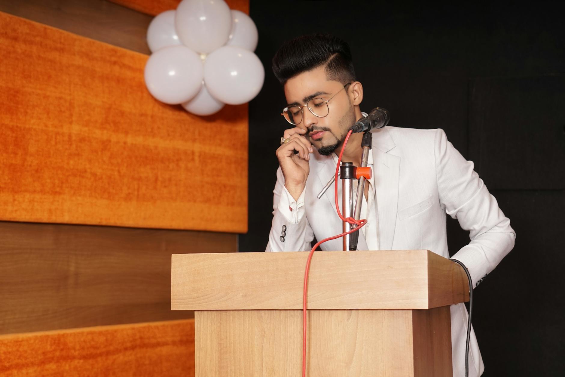 Speaking podium with microphone at political event, representing public leadership and campaign communications