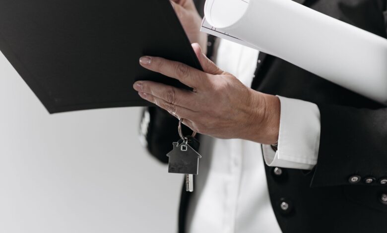 Mortgage documents and financial paperwork spread across a desk