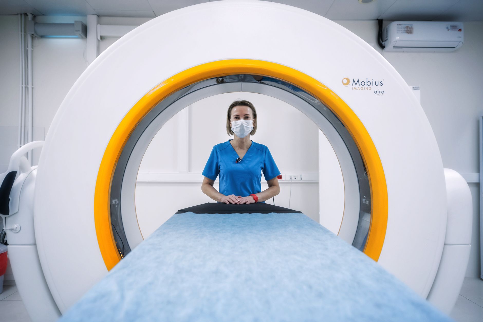 Radiologist reviewing medical scans on a digital workstation in a clinical setting