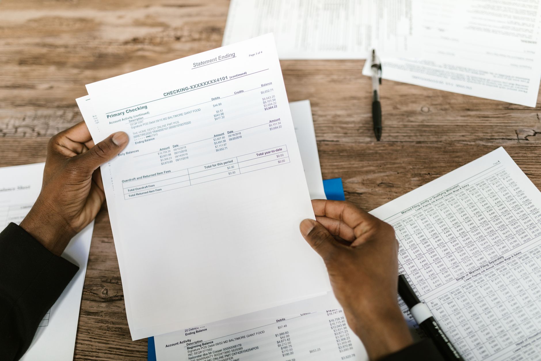 Insurance policy documents and forms spread on a desk