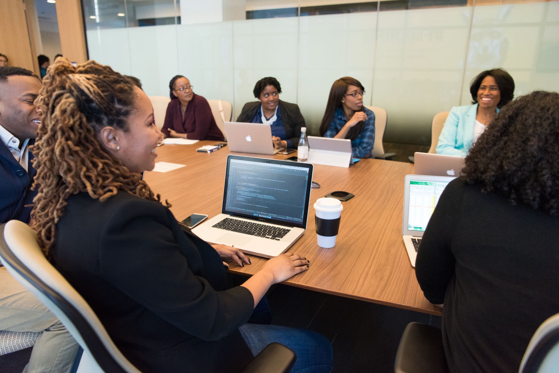 Business professionals in a conference room reviewing commercial property documents