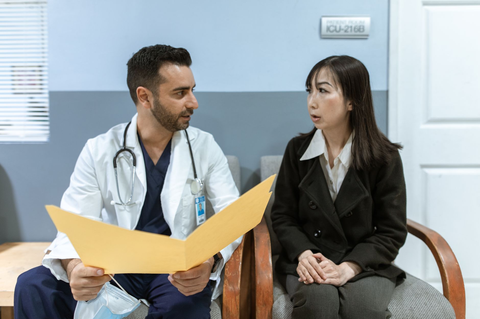 Physicians reviewing documents at a conference table