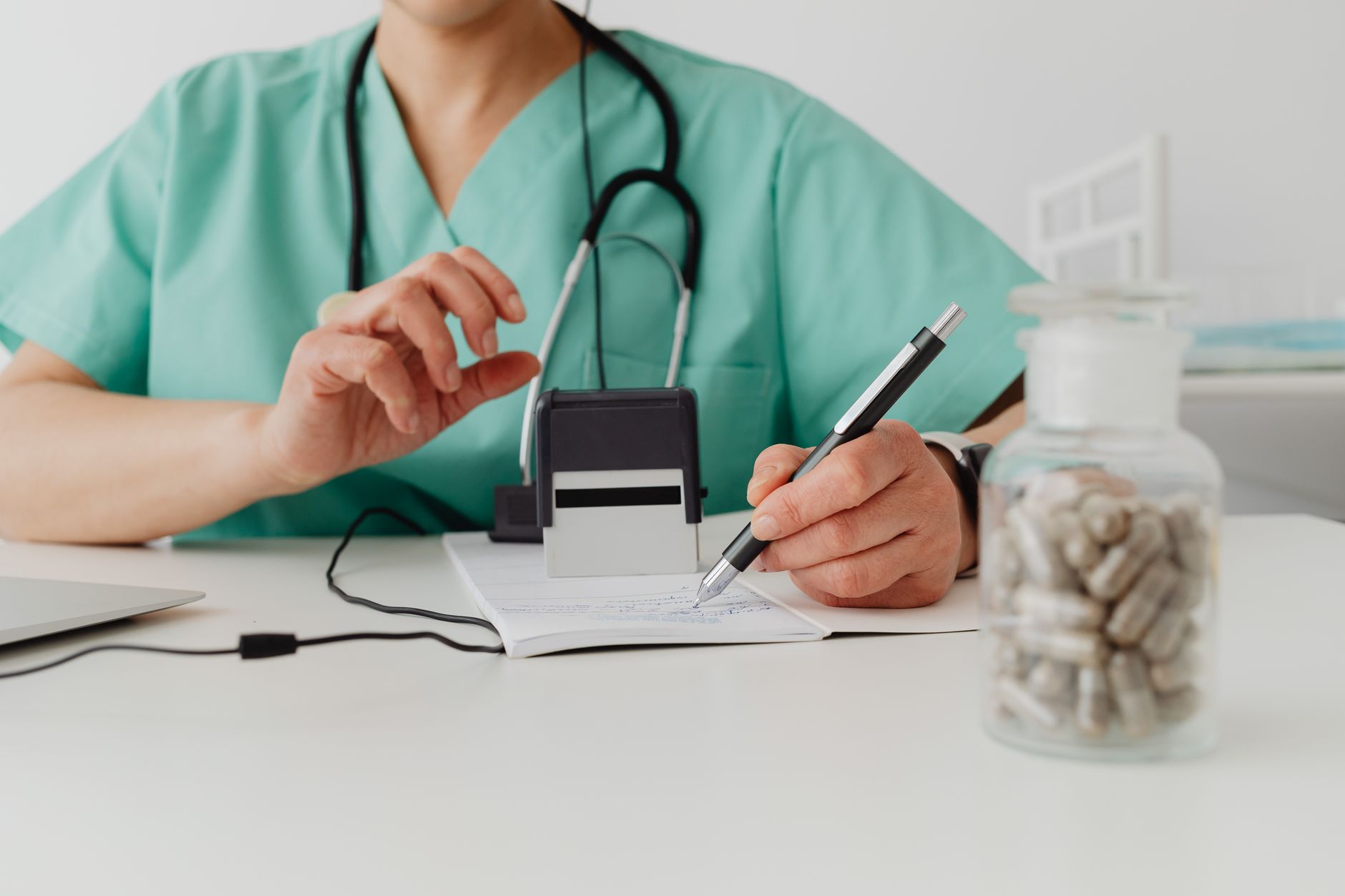 Healthcare administrative staff working on billing and insurance authorization paperwork
