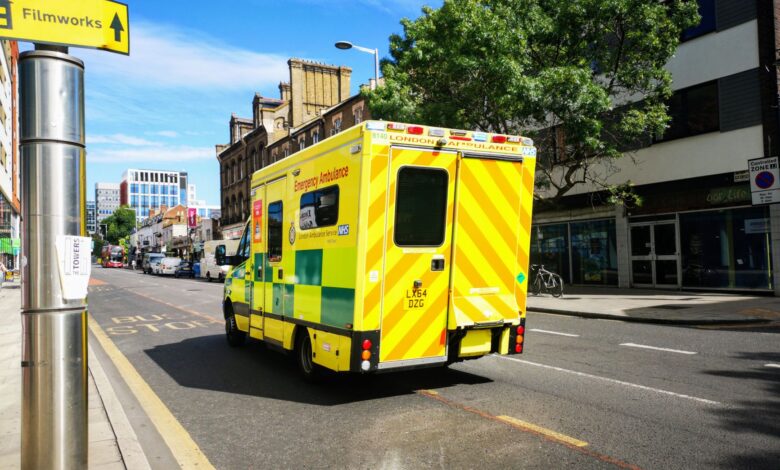 An ambulance driving through a city street representing regional emergency medical services
