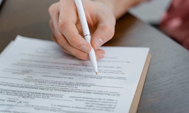 Residential property title documents spread across a desk at a title agency office