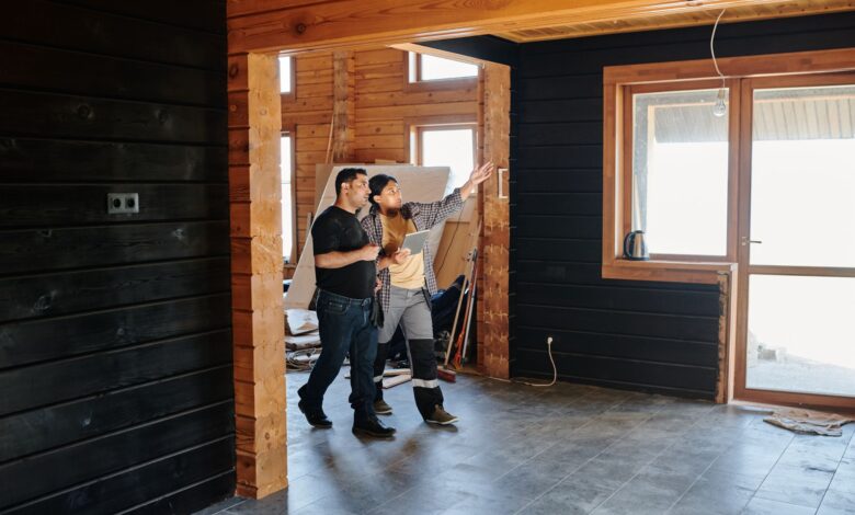A home inspector examining a residential property interior during a professional inspection