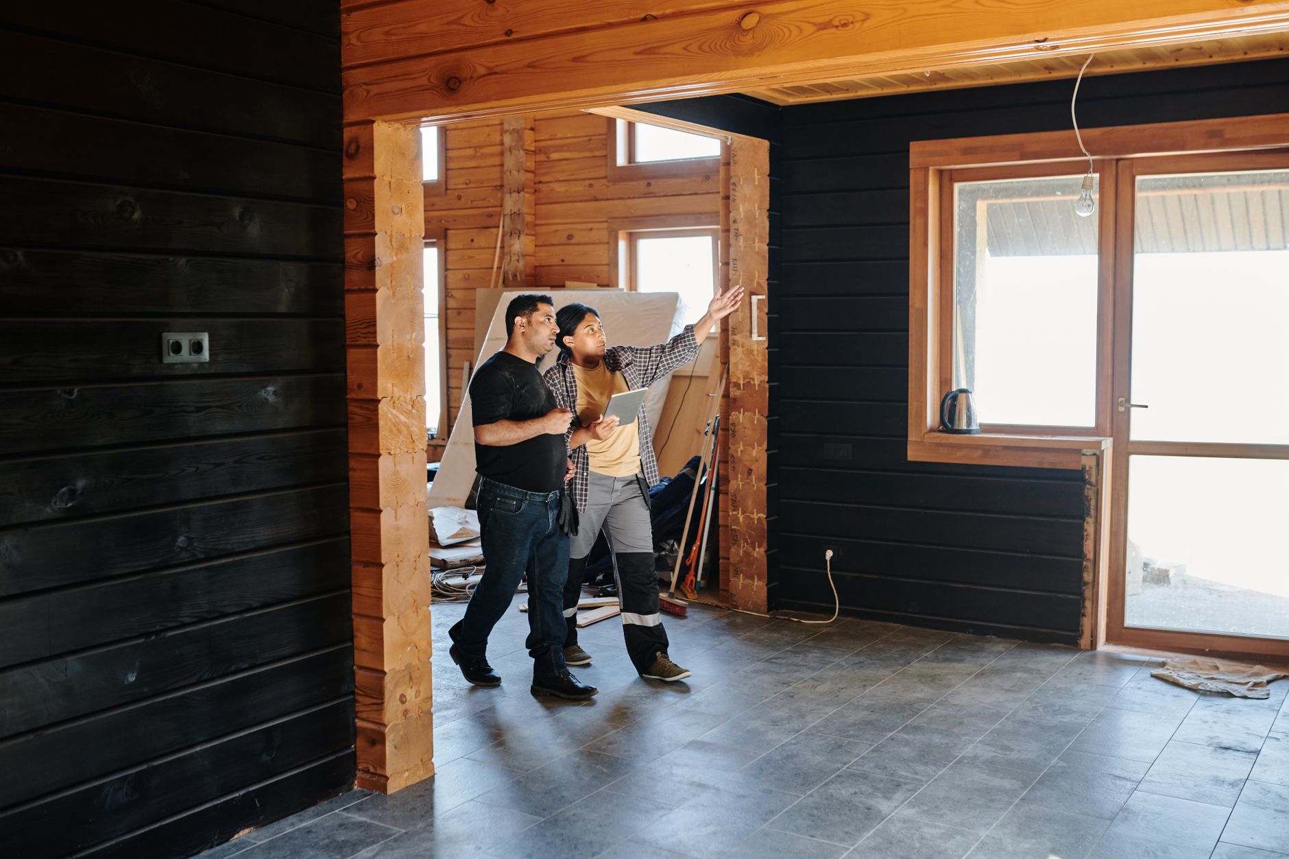 A home inspector examining a residential property interior during a professional inspection