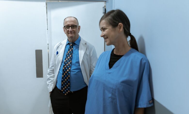 A nurse walking through a hospital hallway representing hospice staffing challenges