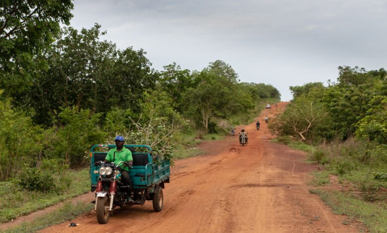 A delivery van on a remote rural road representing medical supply logistics in remote areas