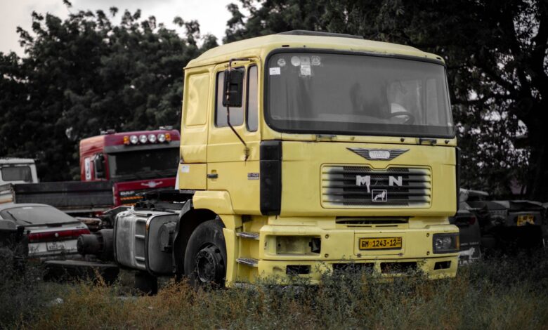 A large fleet of commercial trucks parked in a logistics yard