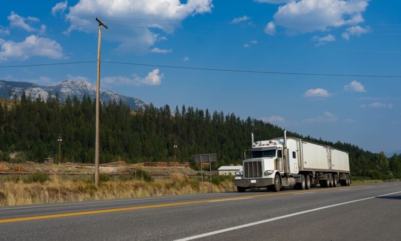Semi-truck driving on a major U.S. highway representing regional freight transportation