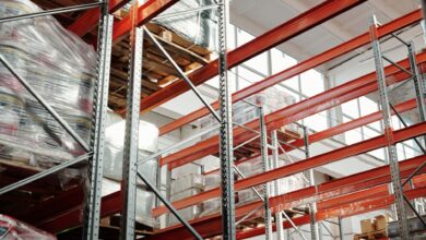 Interior of a large distribution warehouse with shelving and equipment