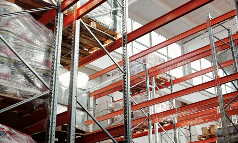 Interior of a large distribution warehouse with shelving and equipment