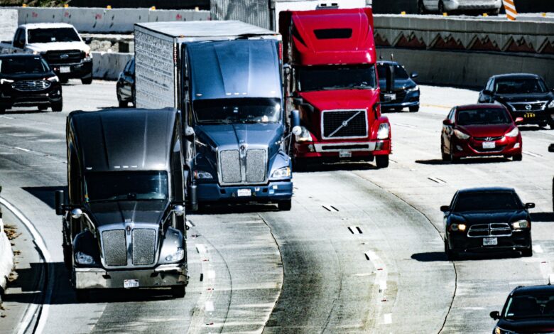 A freight truck driving on an open highway representing regional shipping logistics