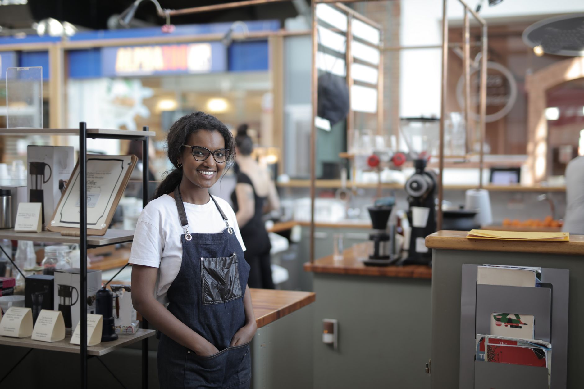 Small business owner reviewing financial paperwork at a counter