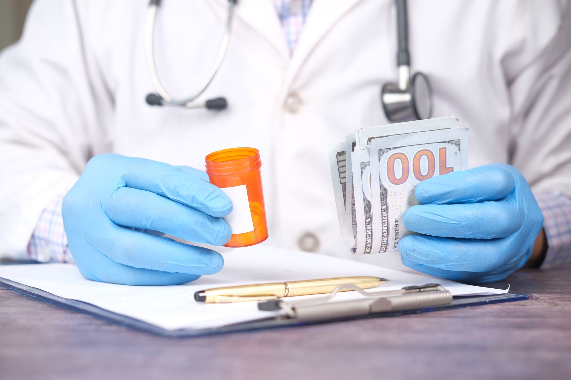 Healthcare administrator reviewing medical billing documents at a desk