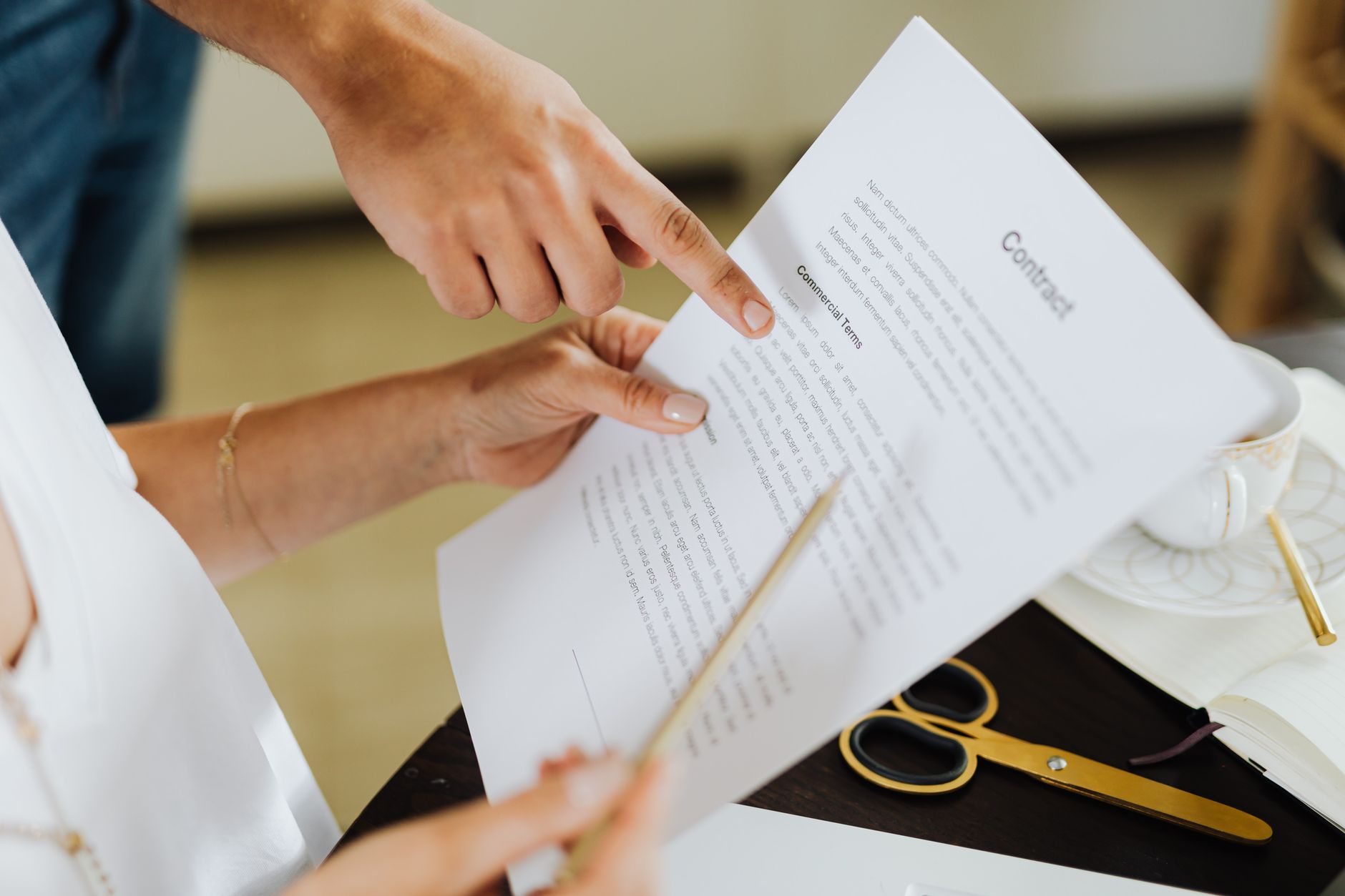 Business professionals reviewing documents at a conference table